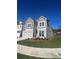 Beautiful home exterior showcasing manicured lawn, gray siding and a side view of the two-car garage at 277 Lakeside Pl, Canton, GA 30114