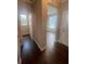 Hallway view with natural light, hardwood floors, and neutral paint at 277 Lakeside Pl, Canton, GA 30114