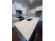 Close up of modern kitchen island featuring quartz countertops and white cabinetry at 277 Lakeside Pl, Canton, GA 30114