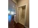 View from the kitchen to the laundry room with shelving and tiled floor at 277 Lakeside Pl, Canton, GA 30114