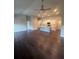 Spacious open-concept living area, hardwood floors and a seamless transition to the modern kitchen at 277 Lakeside Pl, Canton, GA 30114