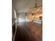 Open concept living area with stone fireplace, hardwood floors and bright modern kitchen at 277 Lakeside Pl, Canton, GA 30114