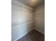 Walk-in closet featuring multiple wire rack shelves for optimal storage and organization at 277 Lakeside Pl, Canton, GA 30114