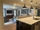 Open-concept kitchen and living room area featuring an island with seating at 3733 Doroco Dr, Atlanta, GA 30340