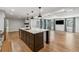 Bright kitchen featuring a central island with seating and hardwood floors at 3733 Doroco Dr, Atlanta, GA 30340