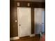 Hallway with two doors, painted dark brown at 428 Poole Bridge Rd, Hiram, GA 30141