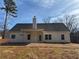 Newly constructed home featuring a classic, neutral color and a spacious backyard at 90 Hammock Dr, Covington, GA 30016