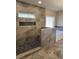 Bathroom with stone shower, and a soaking tub at 90 Hammock Dr, Covington, GA 30016