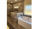 Bathroom with tile shower, and a soaking tub at 90 Hammock Dr, Covington, GA 30016