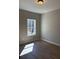 Bedroom with wood flooring, white trim and neutral paint at 90 Hammock Dr, Covington, GA 30016