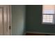 Cozy bedroom with blue walls and a bright window at 430 Poole Bridge Rd, Hiram, GA 30141