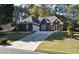Brick ranch house with attached garage and manicured lawn at 1025 Copper Creek Dr, Canton, GA 30114