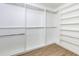 Large walk-in closet with custom shelving and hanging rods at 4154 Liberty Ln, Marietta, GA 30066