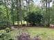 Beautiful backyard with a lush green lawn and wooded area, perfect for outdoor enjoyment at 6054 Nebo Rd, Hiram, GA 30141