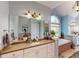 Bathroom featuring granite countertops, dual sinks, a soaking tub, and abundant cabinet storage at 6054 Nebo Rd, Hiram, GA 30141
