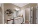 Neutral bathroom with modern vanity, decorative shelves and linen closet at 6054 Nebo Rd, Hiram, GA 30141