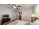 Cozy bedroom with blue walls, ceiling fan, and spacious closet at 6054 Nebo Rd, Hiram, GA 30141