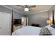 Comfortable bedroom with a four-poster bed, natural light, and ample space at 6054 Nebo Rd, Hiram, GA 30141