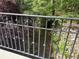 Scenic view of a stream through a bridge railing surrounded by natural vegetation and rock at 6054 Nebo Rd, Hiram, GA 30141