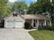 Charming single-Gathering home with a well-manicured lawn, covered porch and two-car garage at 6054 Nebo Rd, Hiram, GA 30141