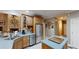 Bright kitchen featuring a large island, stainless steel appliances, and custom cabinetry at 6054 Nebo Rd, Hiram, GA 30141