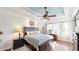 Spacious main bedroom with tray ceilings, a ceiling fan, and lots of natural light at 6054 Nebo Rd, Hiram, GA 30141