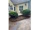 Home exterior featuring a patio area with bushes and a view of the house at 6054 Nebo Rd, Hiram, GA 30141