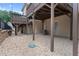 An open backyard with rock cover sits under a raised deck, adding a unique touch to the outdoor space at 3034 Liberty Nw Way, Atlanta, GA 30318
