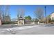 Gated community entrance with guard house, automatic gate arms, and well maintained landscaping at 3034 Liberty Nw Way, Atlanta, GA 30318