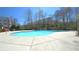 Community pool featuring clear, blue water and concrete deck, perfect for relaxing and soaking up the sun at 3034 Liberty Nw Way, Atlanta, GA 30318
