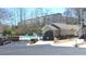 Community pool area with secure fencing, adjacent to a charming building, and easy parking access at 3034 Liberty Nw Way, Atlanta, GA 30318