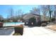 Community pool area with secure fencing, adjacent to a charming building, and easy parking access at 3034 Liberty Nw Way, Atlanta, GA 30318
