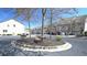 Street view featuring well-maintained townhomes, mature trees, and ample parking for residents and guests at 3034 Liberty Nw Way, Atlanta, GA 30318