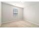 Neutral carpeted bedroom with a window and recessed lighting at 11948 Brightside Pkwy, Hampton, GA 30228
