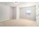 Cozy bedroom with neutral carpet, a window with blinds, and a closet door at 11948 Brightside Pkwy, Hampton, GA 30228