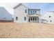 View of the backyard and home's exterior, featuring a covered porch at 735 Crossroad Sw Ct, Powder Springs, GA 30127