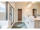 Modern bathroom featuring double vanity, soaking tub and glass enclosed shower at 735 Crossroad Sw Ct, Powder Springs, GA 30127