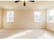 Spacious bedroom with neutral carpet and two windows providing natural light at 735 Crossroad Sw Ct, Powder Springs, GA 30127
