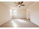 An empty bedroom with carpet, a ceiling fan, and bright lighting at 735 Crossroad Sw Ct, Powder Springs, GA 30127