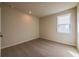 Cozy bedroom with carpet, neutral walls, and a single window for natural light at 735 Crossroad Sw Ct, Powder Springs, GA 30127