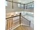 Interior view from staircase overlooking open-concept living spaces at 735 Crossroad Sw Ct, Powder Springs, GA 30127