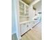 Bright kitchen with white cabinets, quartz countertops, a subway tile backsplash, and stainless steel appliances at 735 Crossroad Sw Ct, Powder Springs, GA 30127