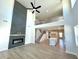 Spacious living room with a fireplace, high ceilings, and view of the kitchen and second-story balcony at 735 Crossroad Sw Ct, Powder Springs, GA 30127