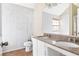 Bathroom boasts double vanity and marble tile at 4118 Lost Springs Trl, Douglasville, GA 30135