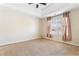 Spacious bedroom with carpeted floors and large window at 4118 Lost Springs Trl, Douglasville, GA 30135