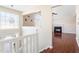 Bright entryway with hardwood floors, white railings, and views to the living room at 4118 Lost Springs Trl, Douglasville, GA 30135