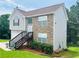 Two-story house with stone and siding accents, attached garage, and steps leading to the front entrance at 4118 Lost Springs Trl, Douglasville, GA 30135