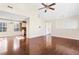Open living room with hardwood floors and views to the kitchen and dining area at 4118 Lost Springs Trl, Douglasville, GA 30135