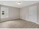 Bright bedroom features a neutral color palette and wood-look floors at 38 Puckett Se Rd, Emerson, GA 30137
