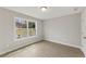Neutral bedroom featuring a large window and wood-look floors at 38 Puckett Se Rd, Emerson, GA 30137